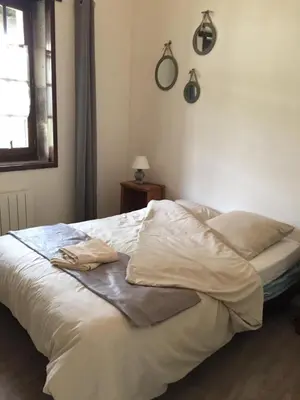 Un ou plusieurs lits dans un hébergement de l'établissement GITE DES CHOUETTES