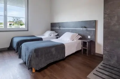Un ou plusieurs lits dans un hébergement de l'établissement Hôtel de la Gare