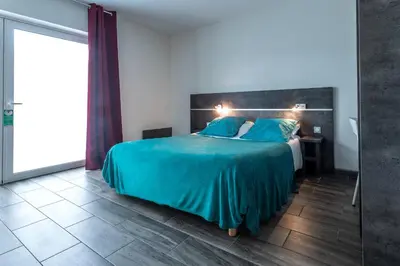 Un ou plusieurs lits dans un hébergement de l'établissement Hôtel de la Gare