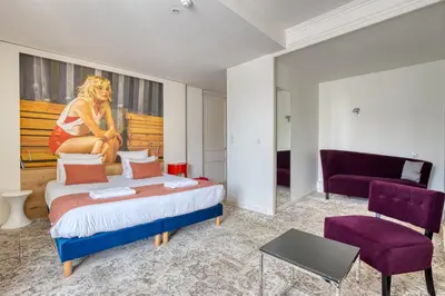 Un ou plusieurs lits dans un hébergement de l'établissement Hotel François 1er Cœur de Ville