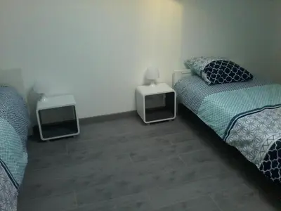 Un ou plusieurs lits dans un hébergement de l'établissement Gîte climatisé *** Le Pigeonnier