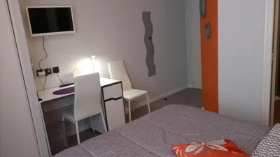 Un ou plusieurs lits dans un hébergement de l'établissement Hôtel Montespan