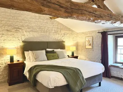 Un ou plusieurs lits dans un hébergement de l'établissement Le Relais de Saint-Preuil, The Originals Relais Vignes du Cognac