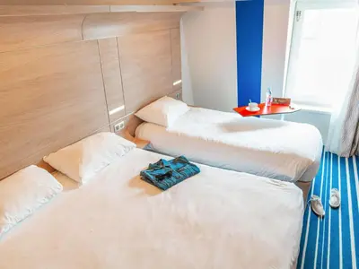 Un ou plusieurs lits dans un hébergement de l'établissement ibis Styles La Rochelle Centre Vieux Port