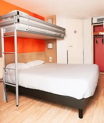 Un ou plusieurs lits dans un hébergement de l'établissement Premiere Classe La Rochelle Nord - Puilboreau