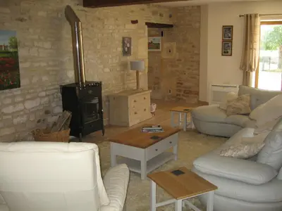 Coin salon dans l'établissement Gite du Puits - Bréville