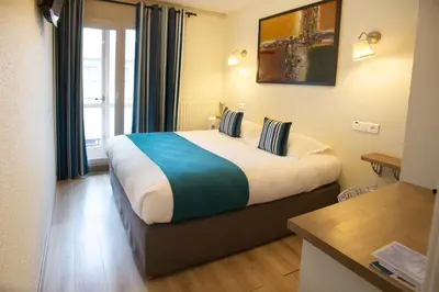 Un ou plusieurs lits dans un hébergement de l'établissement Logis Hotel Epi d'Or