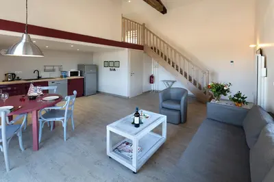 Coin salon dans l'établissement Appartement La Haute Preze & Golffrance
