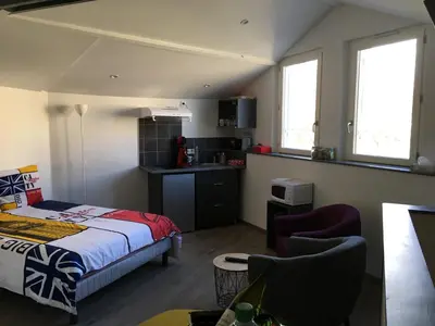 Un ou plusieurs lits dans un hébergement de l'établissement Studio Cosy