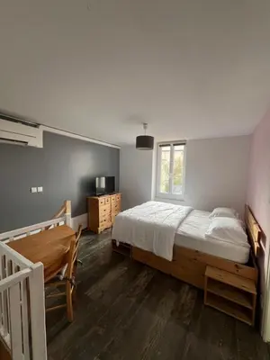 Un ou plusieurs lits dans un hébergement de l'établissement Le Petit Nid Cosy