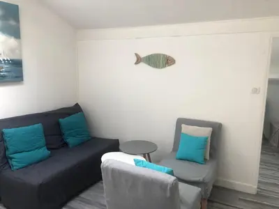 Coin salon dans l'établissement Appartement Arc en Ciel