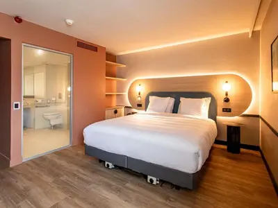 Un ou plusieurs lits dans un hébergement de l'établissement Mercure Angoulême Hôtel de France