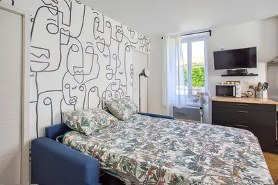 Un ou plusieurs lits dans un hébergement de l'établissement Esprit BD & Confort à Angoulême - Comme à la Maison
