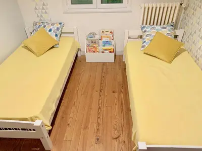 Un ou plusieurs lits dans un hébergement de l'établissement Maison de campagne Chez Trabou et Loulou 20 min de La Rochelle