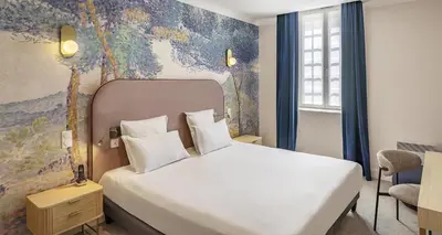 Un ou plusieurs lits dans un hébergement de l'établissement Best Western Plus Poitiers Centre Le Grand Hotel
