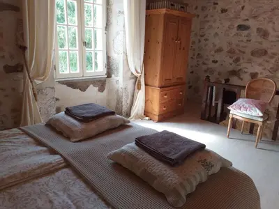Un ou plusieurs lits dans un hébergement de l'établissement Gîte Moulin de Ludièras