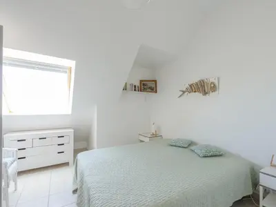 Un ou plusieurs lits dans un hébergement de l'établissement Appartement T2 en Front de Mer avec Balcon, Wifi et Parking - Châtelaillon-Plage - FR-1-258-188