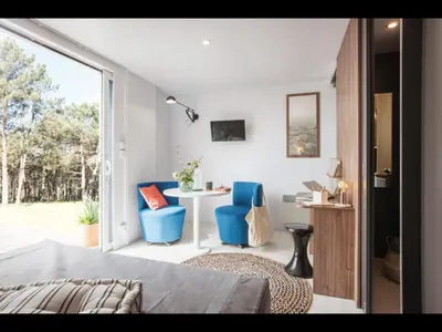 Un ou plusieurs lits dans un hébergement de l'établissement Cottage du garlai
