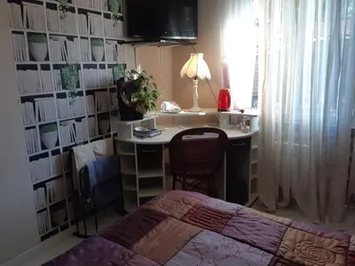 Un ou plusieurs lits dans un hébergement de l'établissement Chambre lit double dans pavillon , chez Lilyanne