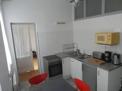 Cuisine ou kitchenette dans l'établissement Appartement T2 ou T1 côté cour/jardin avec garage