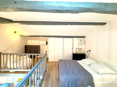 Un ou plusieurs lits dans un hébergement de l'établissement Petite maison tout confort