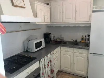 Cuisine ou kitchenette dans l'établissement Gîte des Roses