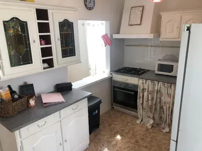 Cuisine ou kitchenette dans l'établissement Gîte des Roses