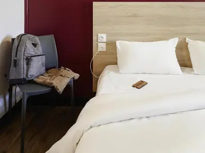 Un ou plusieurs lits dans un hébergement de l'établissement hotelF1 Poitiers Nord Futuroscope