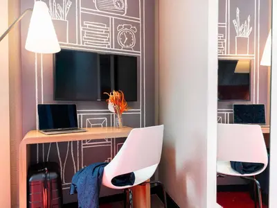 Coin salon dans l'établissement Hôtel Ibis Cognac Centre