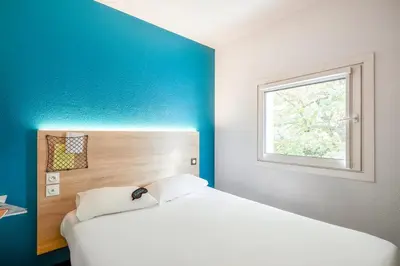 Un ou plusieurs lits dans un hébergement de l'établissement HôtelF1 Angoulême