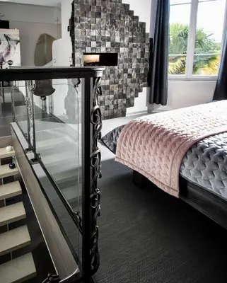 Un ou plusieurs lits dans un hébergement de l'établissement Domaine de l'Angélique - Loft avec SPA privatif - Marais poitevin entre Niort et La Rochelle