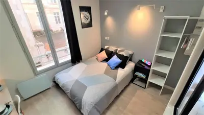 Un ou plusieurs lits dans un hébergement de l'établissement Home&Work 101 - HYPERCENTRE - Parking à proximité