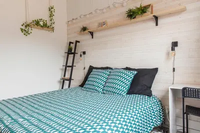 Un ou plusieurs lits dans un hébergement de l'établissement Le RI-BELLOT de 1 à 4 pers - Lit King Size
