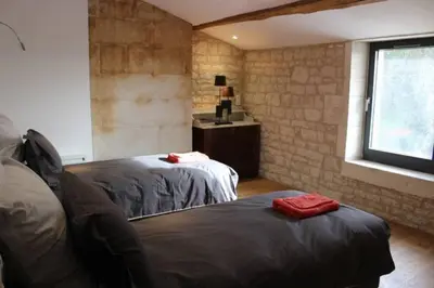 Un ou plusieurs lits dans un hébergement de l'établissement Château des Loups - Les Cèdres Bleus