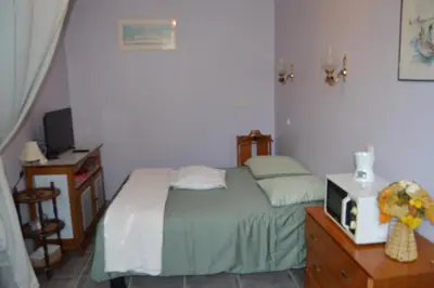 Un ou plusieurs lits dans un hébergement de l'établissement Chambre Charentaise