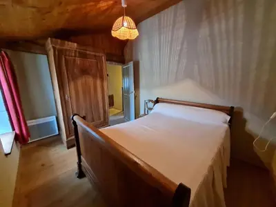 Un ou plusieurs lits dans un hébergement de l'établissement Maison de caractère avec jardin, barque et VTT dans le Marais Poitevin - FR-1-426-139