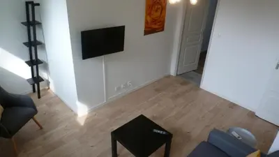 Télévision ou salle de divertissement dans l'établissement Logements Le232Fr Futuroscope Poitiers