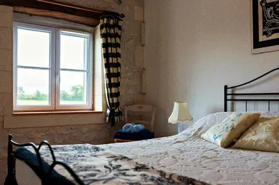 Un ou plusieurs lits dans un hébergement de l'établissement Les Gîtes de Brives