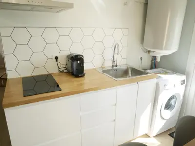 Cuisine ou kitchenette dans l'établissement T2 - 28m2 avec cour et stationnement, wifi et linge fournis
