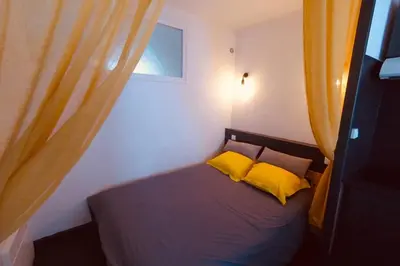 Un ou plusieurs lits dans un hébergement de l'établissement Grand studio à deux pas du Vieux Port