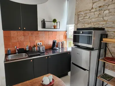 Cuisine ou kitchenette dans l'établissement Maison Laurenza/ La Liversoise
