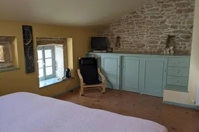 Un ou plusieurs lits dans un hébergement de l'établissement Bienvenue au Barail, maison en pleine nature