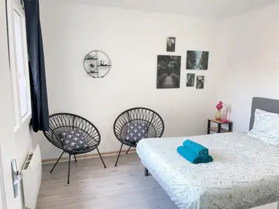 Un ou plusieurs lits dans un hébergement de l'établissement Jolie appartement 2 chambres 65m2 au centre ville