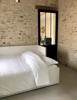 Un ou plusieurs lits dans un hébergement de l'établissement Le Lodge du Chêne