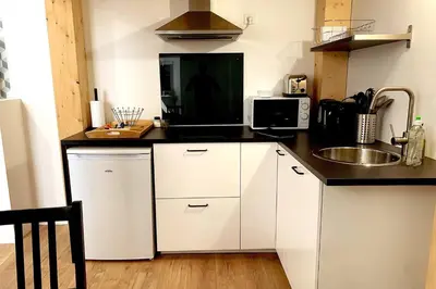 Cuisine ou kitchenette dans l'établissement Le NOTRE DAME - HYPER CENTRE - WIFI - NETFLIX