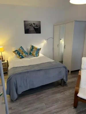 Un ou plusieurs lits dans un hébergement de l'établissement Le P'tit Gris Studio cosy et rénové
