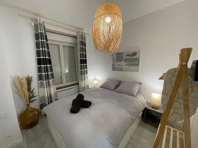 Un ou plusieurs lits dans un hébergement de l'établissement Le Bohème - Centre Ville, Netflix et WIFI, parking, idéal familles, couples et voyages d'affaire