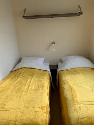 Un ou plusieurs lits dans un hébergement de l'établissement Camping de la ferme aux ânesses, mobil home sofia2