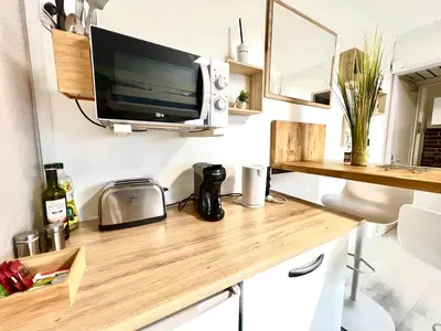 Cuisine ou kitchenette dans l'établissement Studio cosy Bali 1 à 4 pers porte du Futuroscope