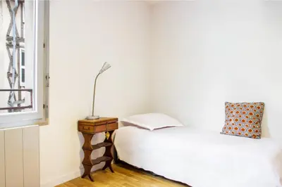 Un ou plusieurs lits dans un hébergement de l'établissement Le Vintage - Grand Appartement hypercentre
